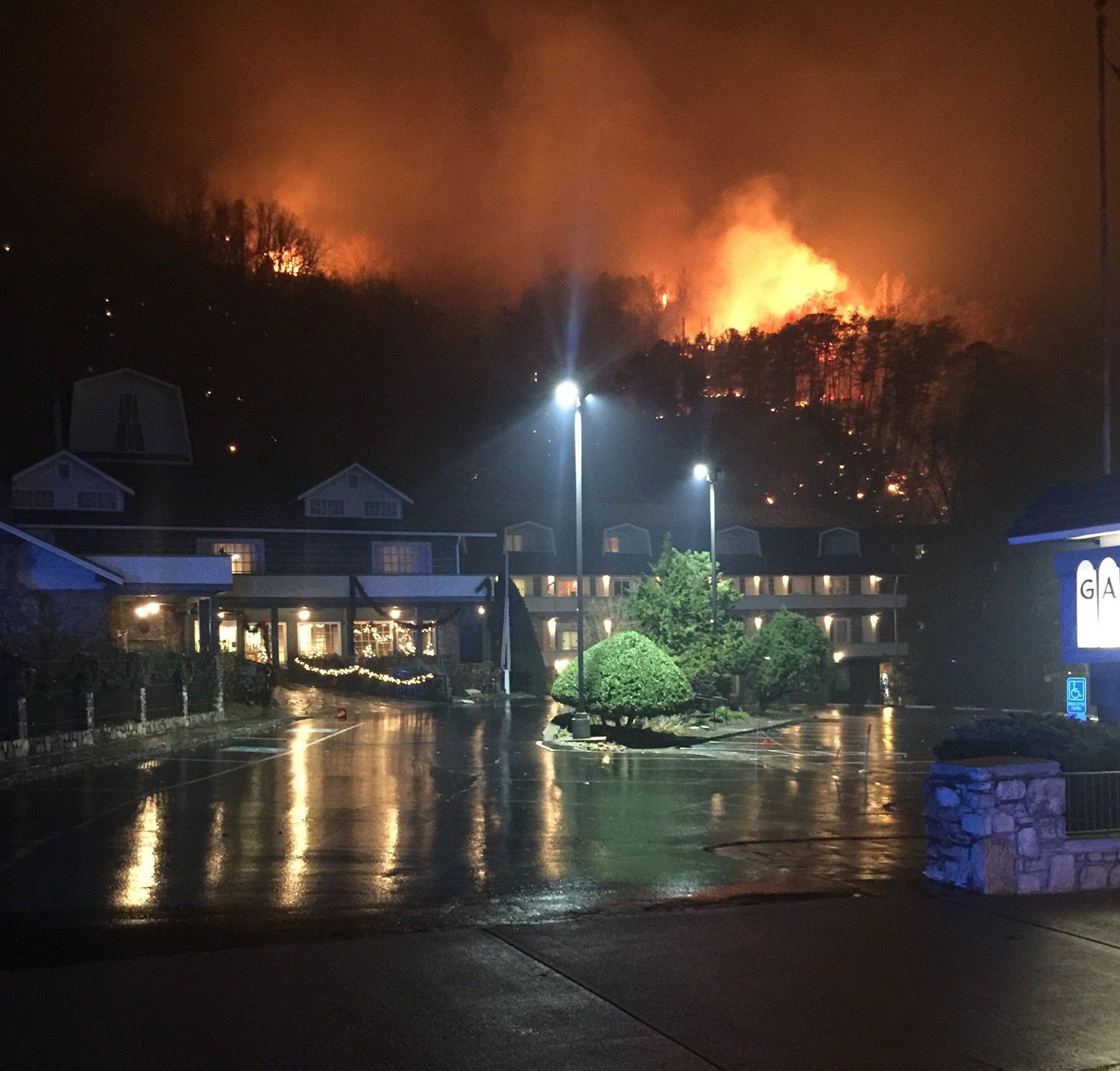 A wildfire burns on a hillside after a mandatory evacuation was ordered in Gatlinburg