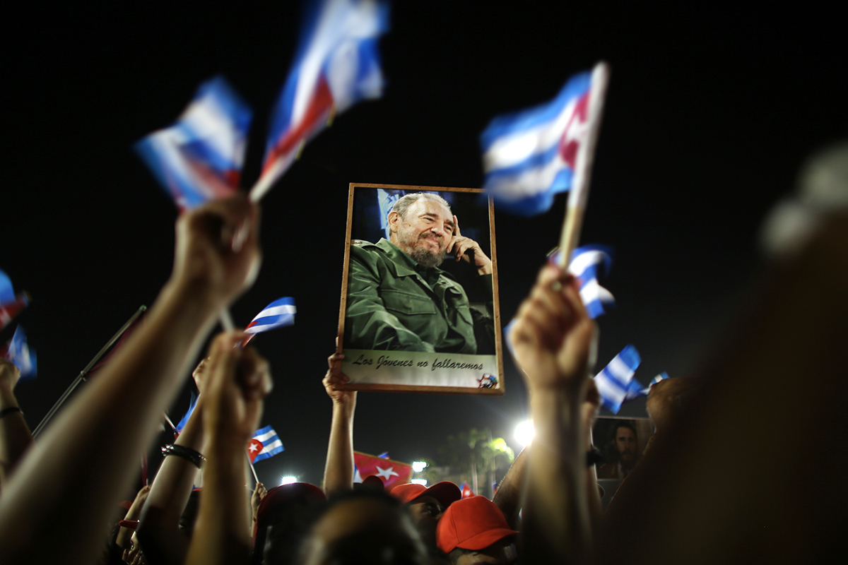 People cheer at a tribute to former Cuban leader Fidel Castro in Santiago de Cuba