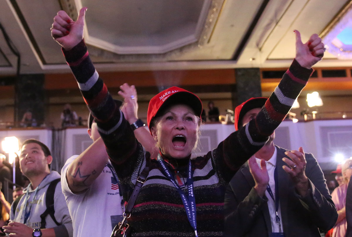 Supporters of U.S. Republican presidential nominee Donald Trump celebrate the results from Ohio and Florida at his election night rally in Manhattan