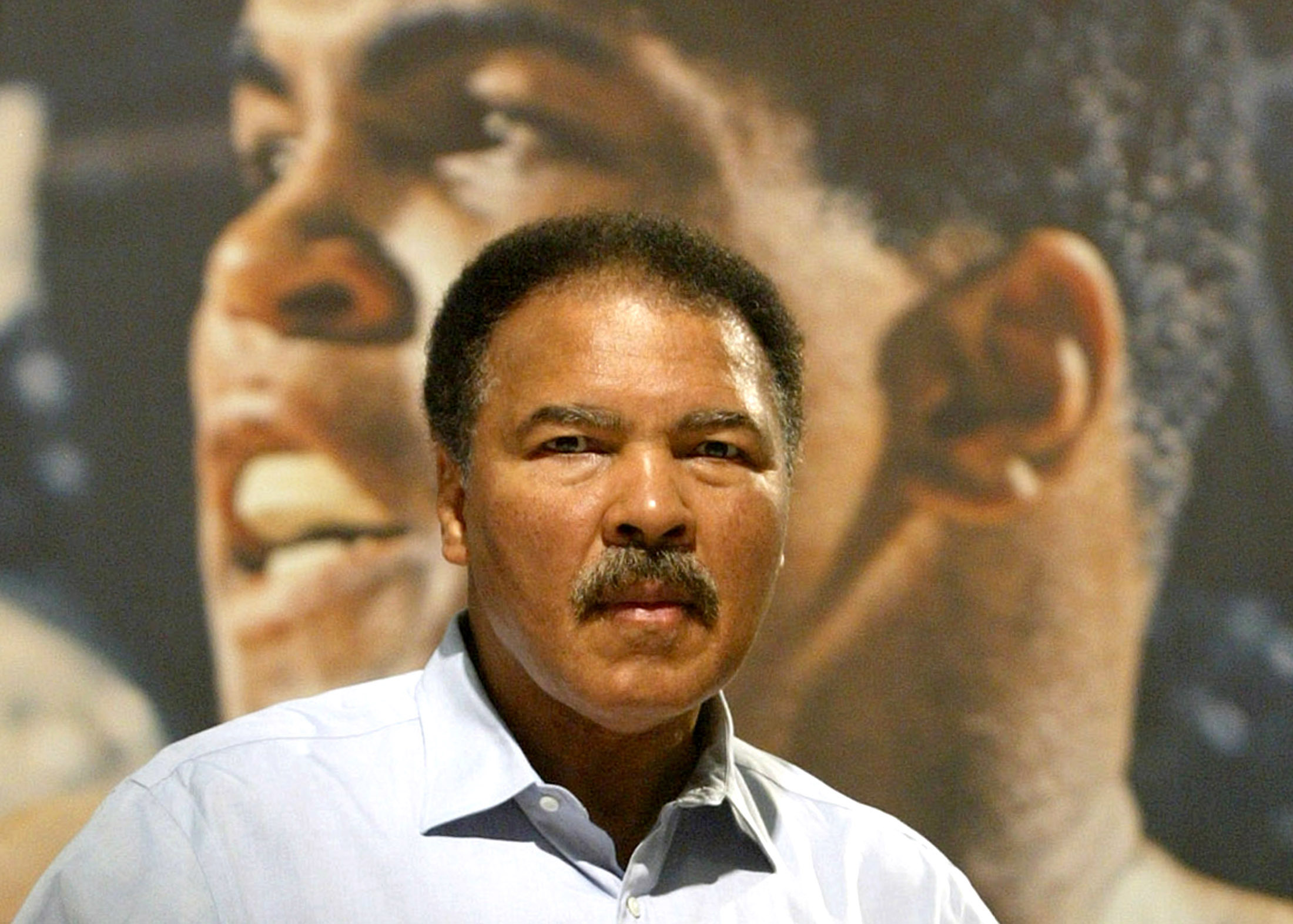 MOHAMMAD ALI POSES DURING A PRESENTATION AT THE FRANKFURT BOOKFAIR.