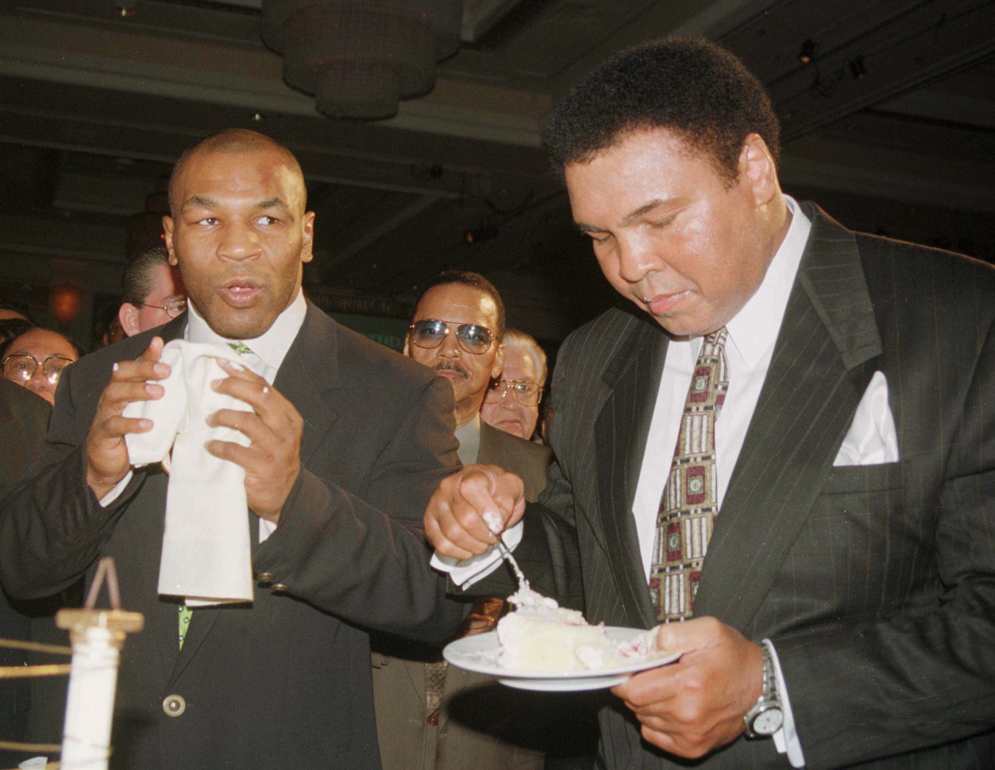 MUHAMMAD ALI CELEBRATES HIS BIRTHDAY WITH MIKE TYSON.