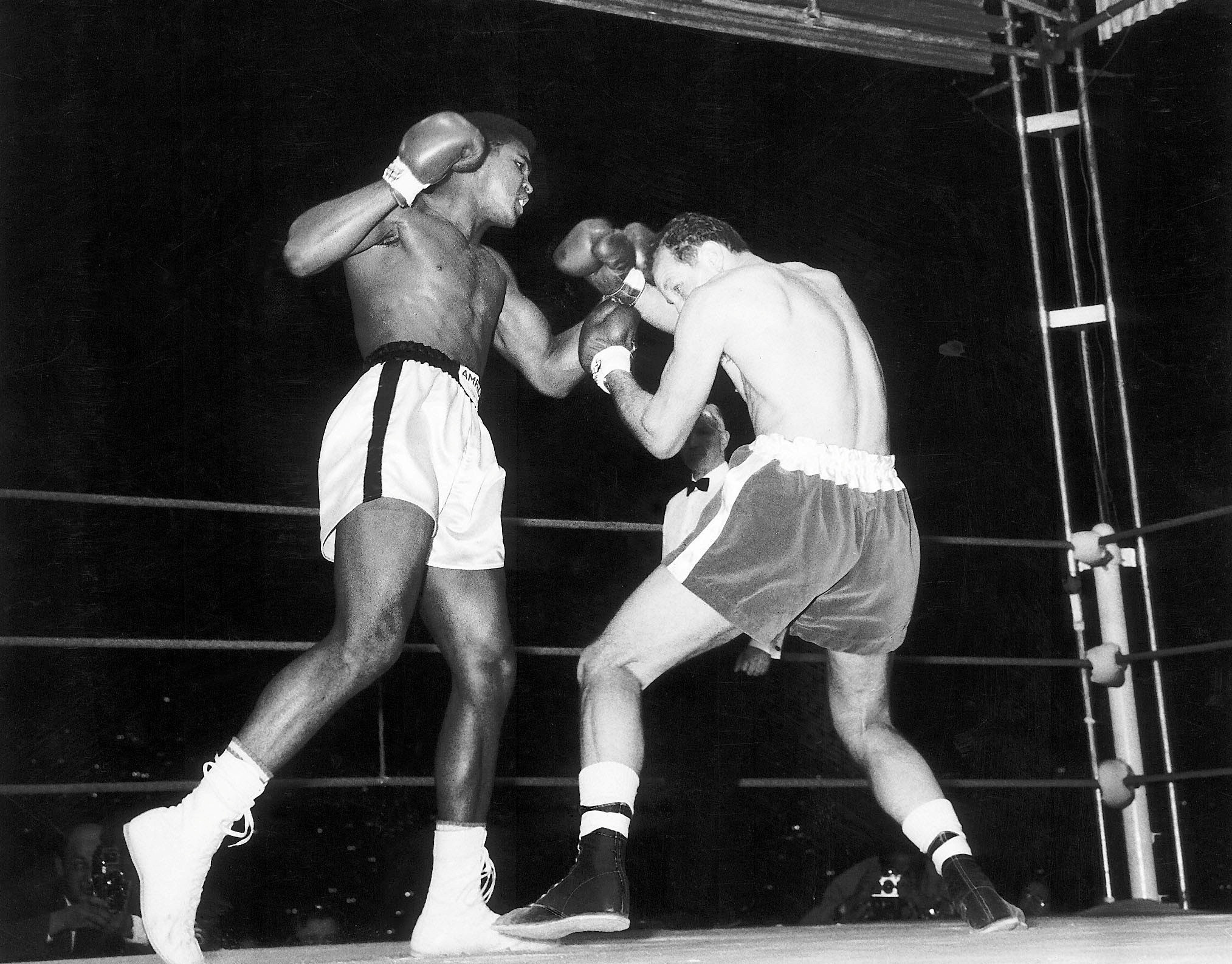  Cassius Clay, (later Muhammad Ali) fights Henry Cooper at Wembley Stadium in London