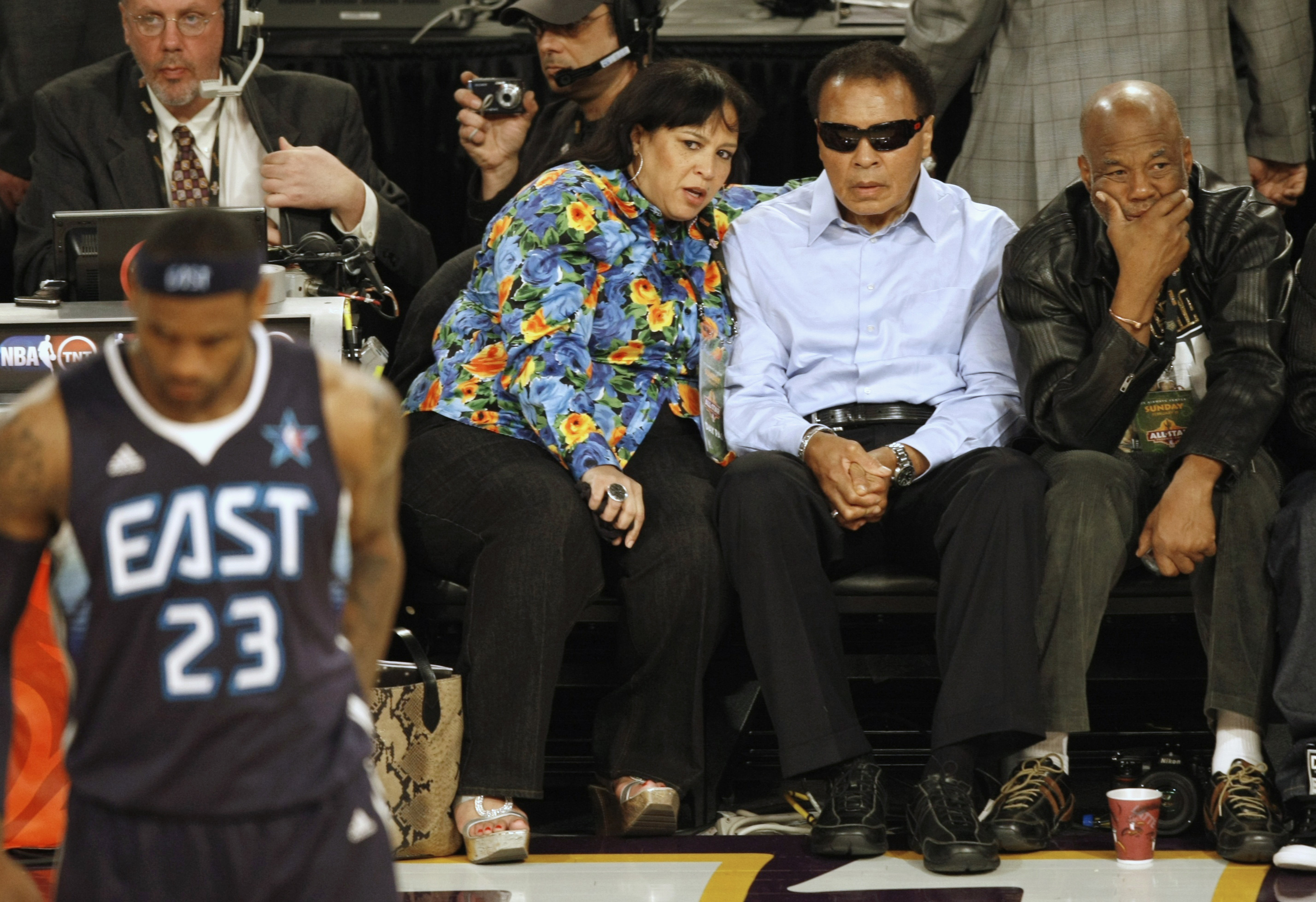 Muhammad Ali watches during the first quarter of the NBA All-Star basketball game in Phoenix