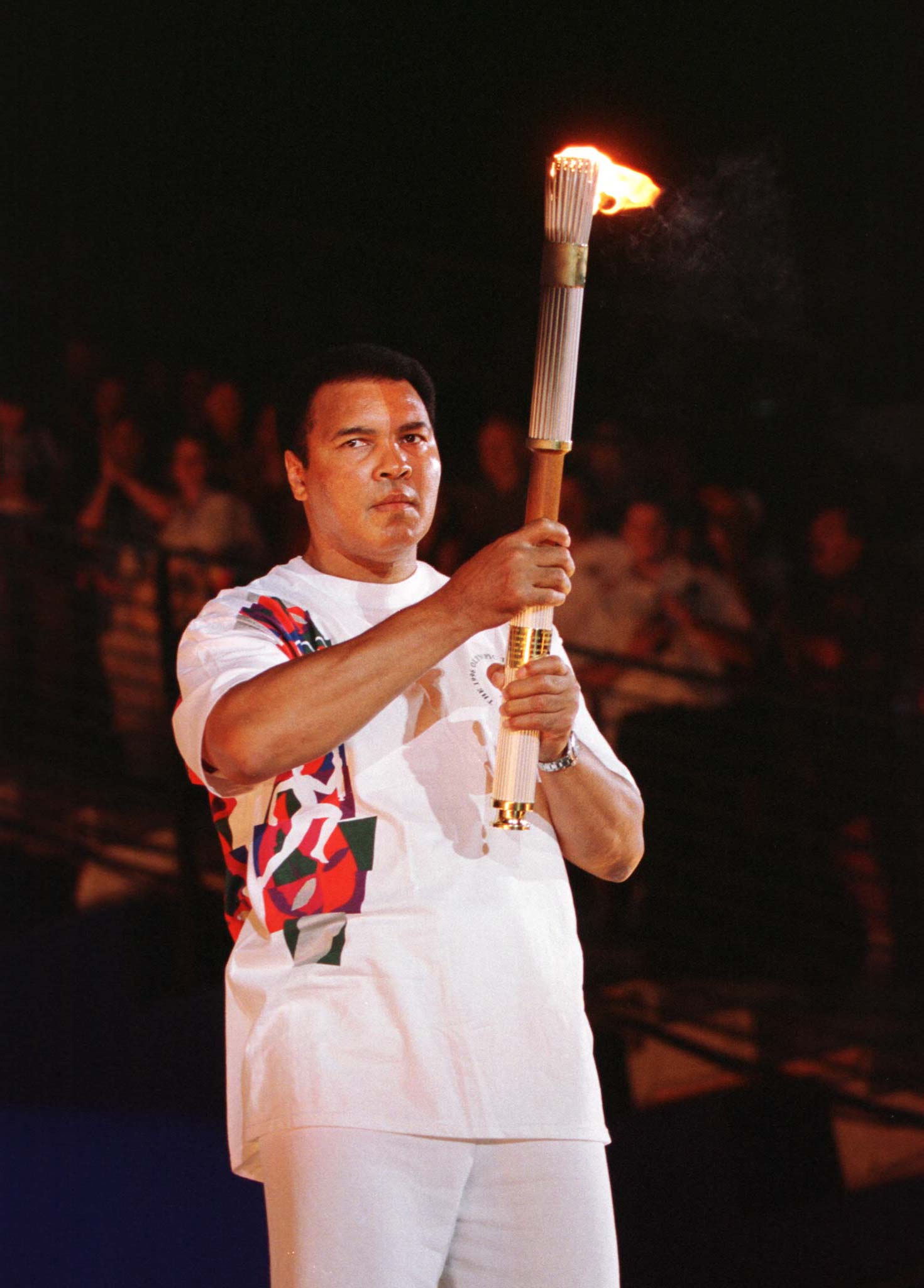 FORMER BOXER MUHAMMAD ALI WITH OLYMPIC TORCH