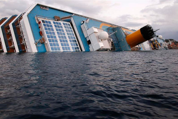 The Costa Concordia cruise ship lying on its side.