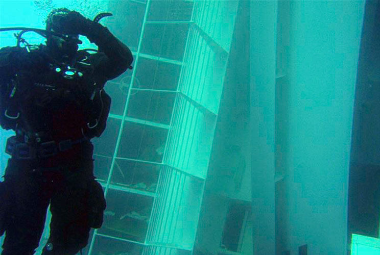 A scuba diver inspects a side of the Costa Concordia in this photo released on January 16.