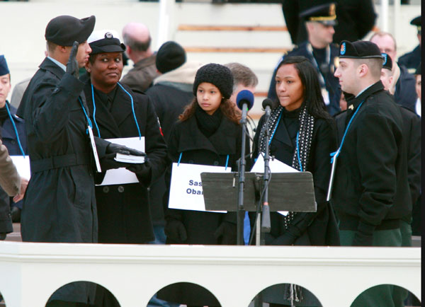 		<p>Army Staff Sgt Derrick Brooks (L) stands in for President-elect Barack Obama during a rehearsal for the inaugural swearing-in ceremonies as he stands with Navy Yeoman 1st Class LaSean McCray (2nd L), representing Michelle Obama, Dominique Sewell (2nd