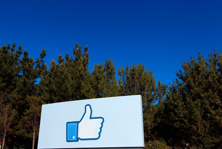 A giant "like" icon made popular by Facebook is seen at the campus. 