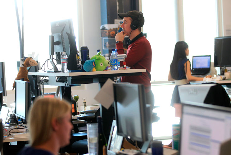 Employees choose to either sit or stand while working.  