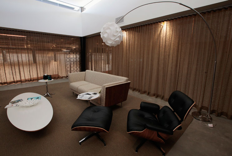 An Eames chair sits in the Eames meeting room, where no technology is allowed.