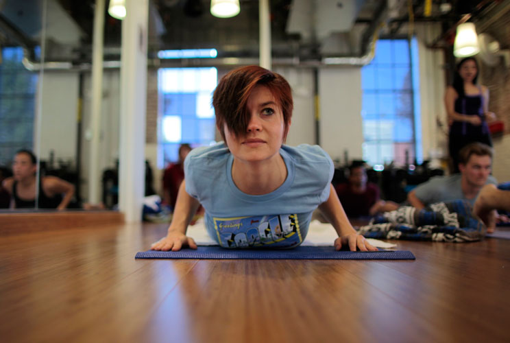 Google employees take part in a yoga class. 