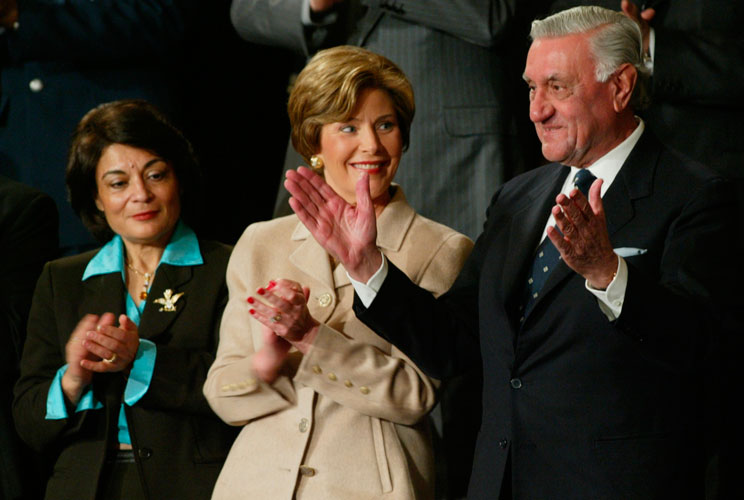 First lady Laura Bush and Iraqi Senior Diplomatic Representative Rend Al-Rahim (left) applaud Iraqi Governing Council President Dr. Adnan Pachachi as he is recognized by President George W. Bush during the State of the Union address on January 20, 2004.