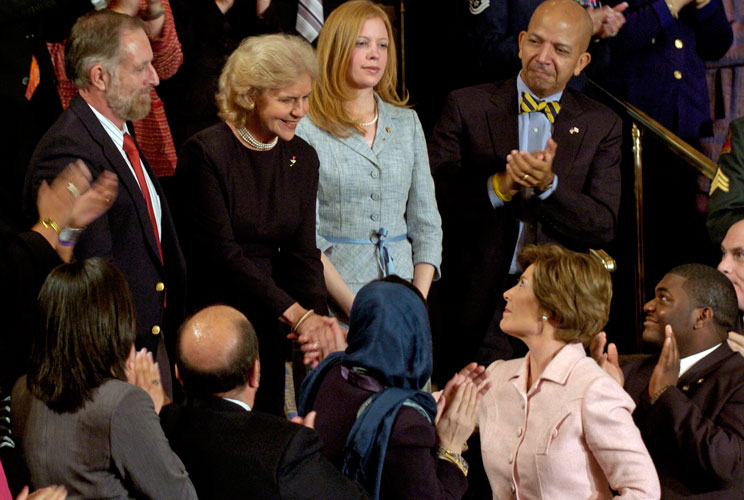 First lady Laura Bush shakes hands with Sara Jo Clay while the Clay family is introduced during President George W. Bush's State of the Union address.Clarence and Sara Jo Clay's son, Staff Sergeant Dan Clay, was killed in Fallujah in December 2005.