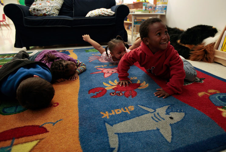 Aaden Cottrell (R), 3, plays at the Hope Gardens Family Center.