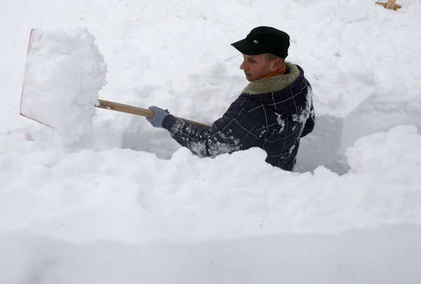 		<p>A man of the Kosovo Muslim minority Gorani shovels snow after heavy snowfall in the village of Krusevo, in the triangle between Kosovo, Macedonia and Albania January 10, 2012.</p>