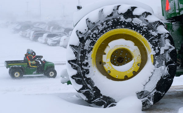 		<p>Parking attendants drive a cart in blizzard conditions outside the Credit Union Centre during the Canadian Men's Curling Championships in Saskatoon, Saskatchewan March 6, 2012. A severe winter storm blew in overnight causing white out conditions with