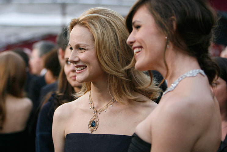 Best actress Oscar nominee Laura Linney of the film "The Savages", wearing jewelry from Cathy Waterman, poses with actress Jennifer Garner, who stars in the best picture Oscar nominated film "Juno," as they arrive at the 2008 Academy Awards. 