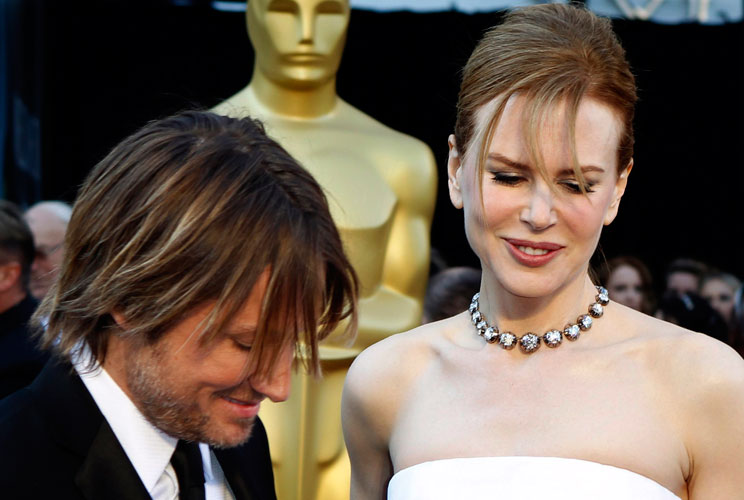 Australian actress Nicole Kidman, best actress nominee for her role in "Rabbit Hole", and her husband Keith Urban arrive at the 2011 Academy Awards. Kidman's necklace is by Fred Leighton. 