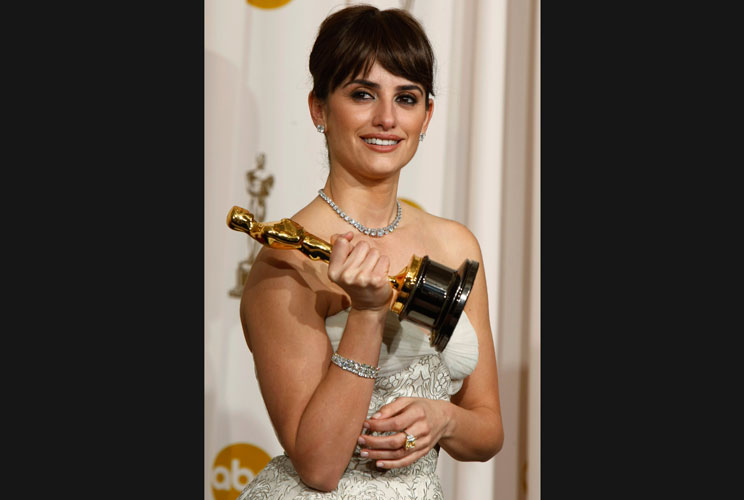 Best supporting actress winner Penelope Cruz for "Vicky Cristina Barcelona" holds her Oscar backstage at the 2009 Academy Awards.  