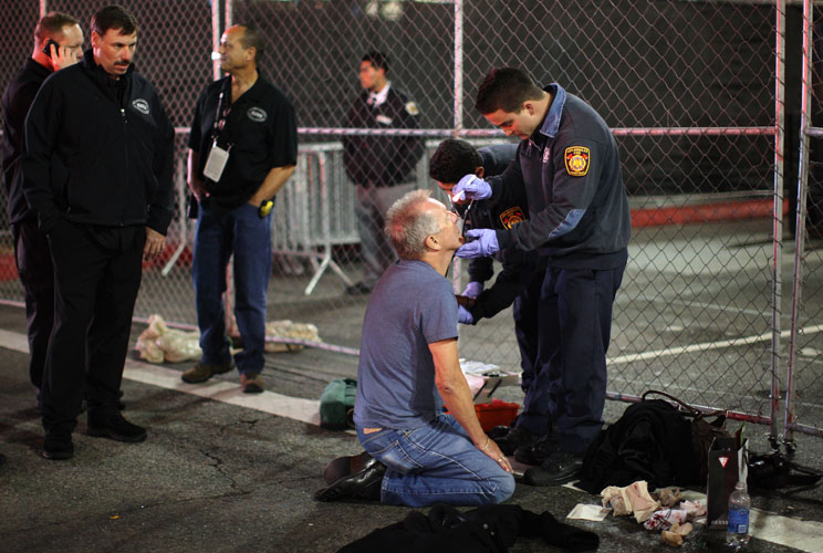 A man is treated for an unknown medical problem near the site of the 84th Academy Awards on Hollywood Boulevard.