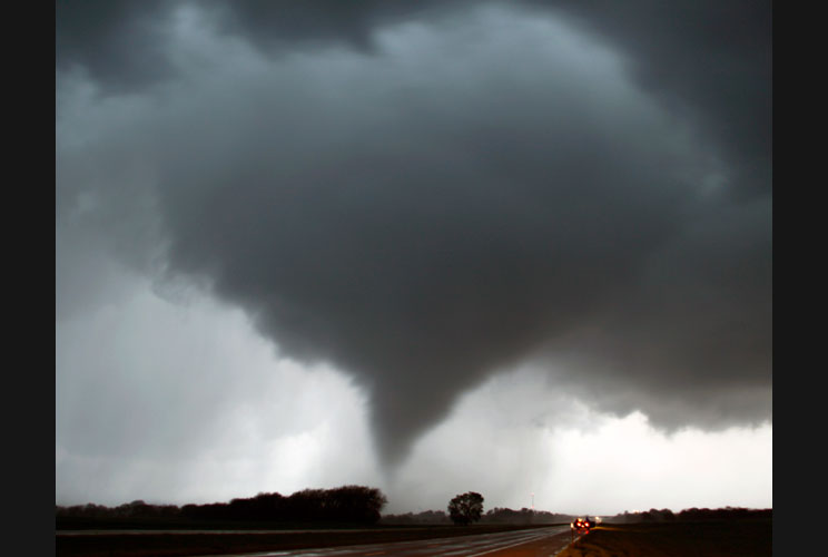 A tornado makes its way over the 135 freeway near Moundridge, Kansas.