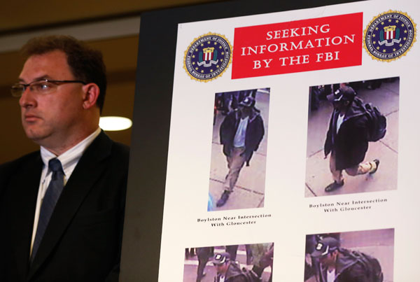 		<p>Photos of a suspect in the Boston Marathon bombings are seen during a news conference in Boston, Massachusetts April 18, 2013. The FBI said on Thursday that it has identified two suspects in the Boston Marathon bombing and is asking the public for he