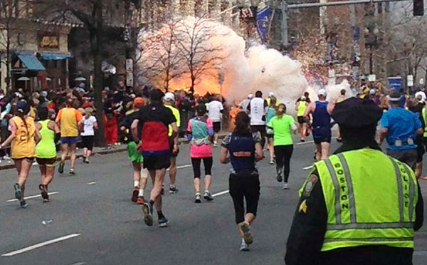 		<p>Runners and spectators near the finish line of the Boston Marathon as an explosion erupts in this photo exclusively licensed to Reuters by photographer Dan Lampariello Boston, Massachusetts.</p>