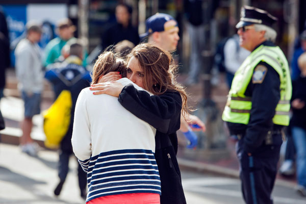 		<p>A woman comforts another, who appears to have suffered an injury to her hand, after explosions interrupted the 117th Boston Marathon in Boston, Massachusetts April 15, 2013. Two people were killed and 23 others injured after two explosions struck the