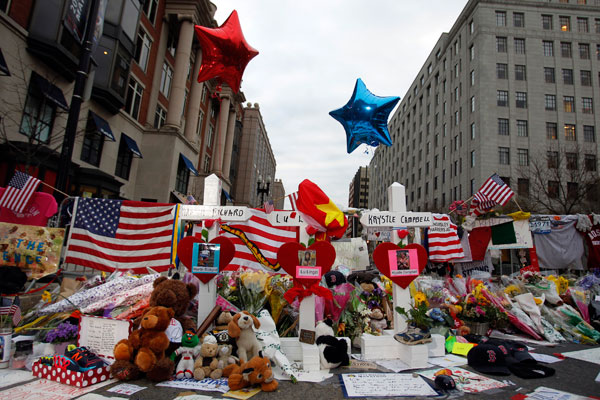 		<p>Three crosses for each of the three people killed in the Boston Marathon bombings are seen at a makeshift memorial on Boylston Street in Boston, Massachusetts, April 18, 2013. Investigators released pictures of two suspects in the Boston Marathon bom