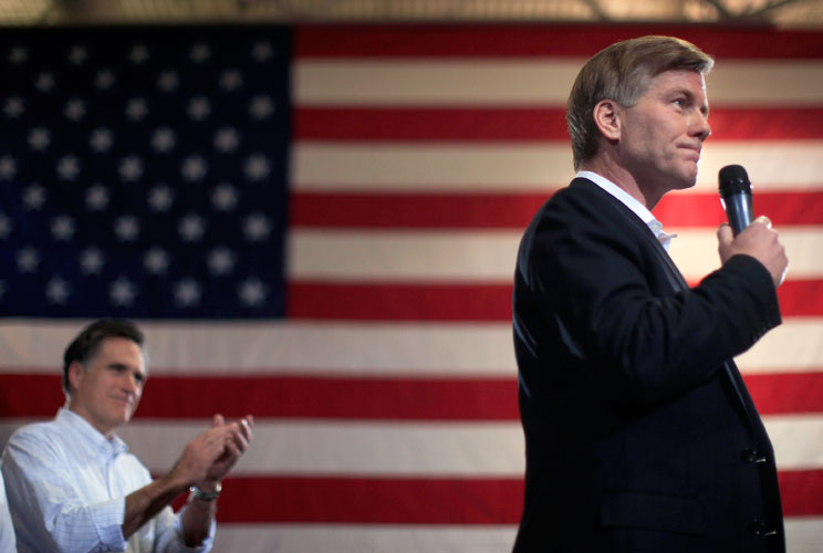 U.S. Republican presidential candidate and former Massachusetts Governor Mitt Romney (L) applauds his endorsement from Virginia Governor Bob McDonnell during a campaign rally in North Charleston, South Carolina, January 20, 2012. 