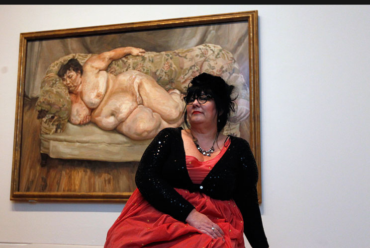 Sue Tilley poses under the 1995 oil painting, "Benefits Supervisor Sleeping" (which she modelled for) by British artist Lucien Freud, at a viewing at the National Portrait Gallery in London, February 8, 2012. The painting fetched $33.6 million at a Christ