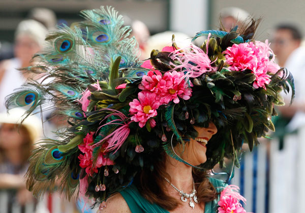 		<p>A woman wears a fancy hat before the Kentucky Derby at Churchill Downs in Louisville, Kentucky, May 5, 2012.  </p>