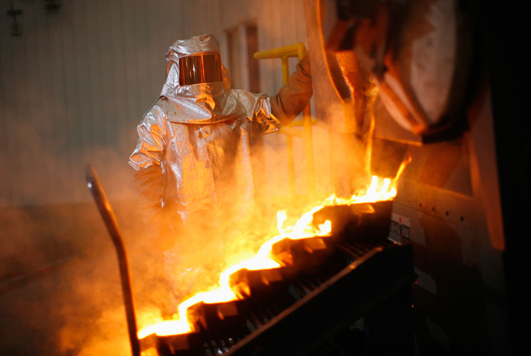 Gold is poured during a tour of Agnico-Eagle's Meadowbank mine near Baker Lake, Nunavut, August 24, 2011. At the rim of the Arctic Circle in Canada, gold mining firm Agnico-Eagle is learning how tough it is to operate in a remote region with temptingly la