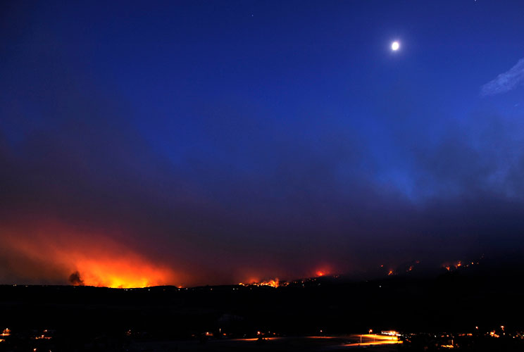 The Waldo Canyon fire burns off the southern border of the U.S. Air Force Academy in Colorado Springs, Colorado, in a June 26 photo. Mandatory evacuations have been ordered for all housing residents on the Air Force Academy as the fire continues to spread