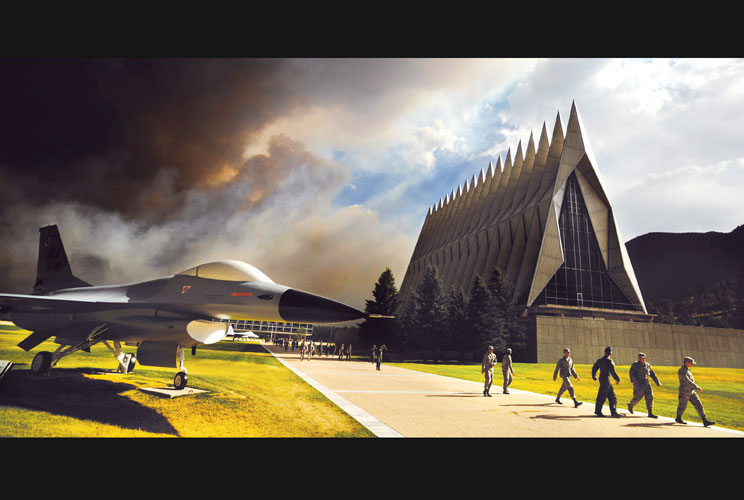 Smoke from the Waldo Canyon fire is shown near the Air Force Academy's chapel as cadets head to a briefing on evacuation procedures, in this U.S. Air Force photo dated June 27, 2012. The Academy evacuated more than 600 families and 110 dormitory residents