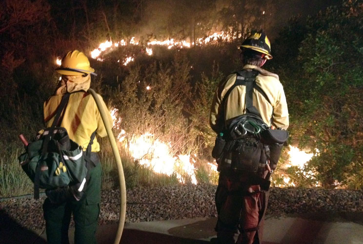 Firefighters work on the Waldo Canyon fire near Colorado Springs, Colorado, in a June 26 photo. The Waldon Canyon fire has killed two people and destroyed over 17,000 acres after being ignited on June 13, 2012. 