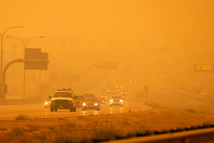 Smoke from the Waldo Canyon fire engulfs the I-25 north of Colorado Springs, CO, June 26, 2012. A monster Colorado wildfire raging near some of the most visited tourist areas in the state took a turn for the worse on Tuesday as hot winds pushed flames nor