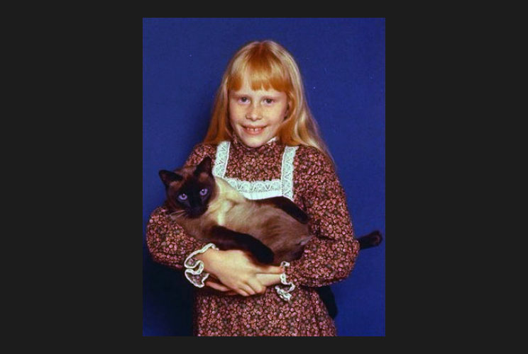 Amy Carter, daughter of Jimmy Carter (1977-81), holds her Siamese cat, Misty Malarky Ying Yang.