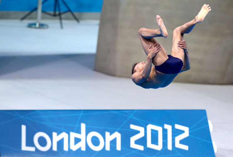 A diver jumps off a 3-metre springboard during a training session at the Aquatics Centre before the start of the London 2012 Olympic Games in London, July 22, 2012. 