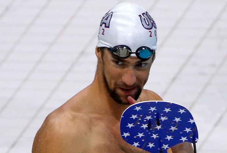 Michael Phelps is seen during a training session of the U.S. swimming team at the main pool of the Aquatics Centre before the start of the London 2012 Olympic Games in London July 24, 2012.  REUTERS/David Gray (BRITAIN  - Tags: SPORT OLYMPICS SWIMMING)