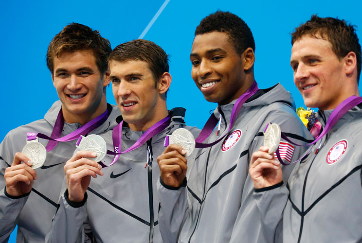 Nathan Adrian, Michael Phelps, Cullen Jones and Ryan Lochte (L-R) of the U.S. pose with their silver medals in the men's 4x100m freestyle relay victory ceremony during the London 2012 Olympic Games at the Aquatics Centre July 29, 2012. 