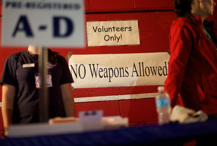 A "No Weapons Allowed" sign is posted at entrance to the clinic. 