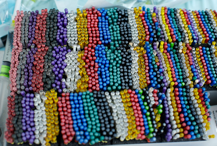 An array of root canal files are lined up in the dentistry tent. 