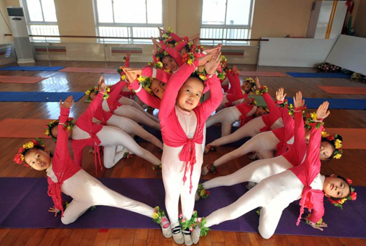 Children take ballet class at an exclusive kindergarten in Beijing.