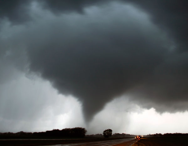 		<p>A tornado makes its way over the 135 freeway near Moundridge, Kansas, during the third day of severe weather and multiple tornado sightings, April 14, 2012. A spate of tornadoes tore through parts of Oklahoma, Kansas, Nebraska and Iowa, churning thro