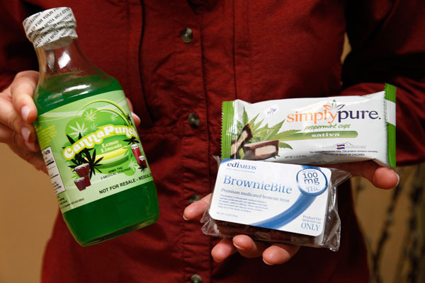 		<p class="p1">Sue Harank, co-owner of marijuana dispensary Alpine Herbal Wellness, poses with some of her products containing THC in her shop in Denver. </p>    <br />    <p class="p1">Marijuana dispensaries in U.S. states that have legalized medical po