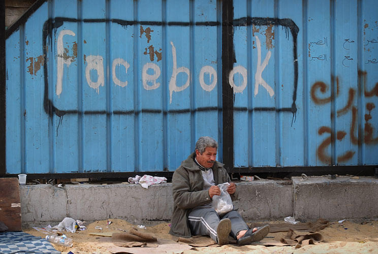 A fence is spray painted with the word Facebook in Tahrir Square on February 4, 2011 in Cairo, Egypt. Anti-government protesters called it 'The day of departure'. Thousands have again gathered in Tahrir Square calling for Egyptian President Hosni Mubarak 