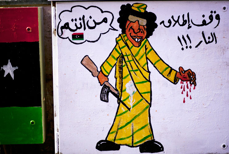 Graffiti on a wall mocks disposed leader Muammar Gaddafi on October 18, 2011 in Benghazi, Libya. 