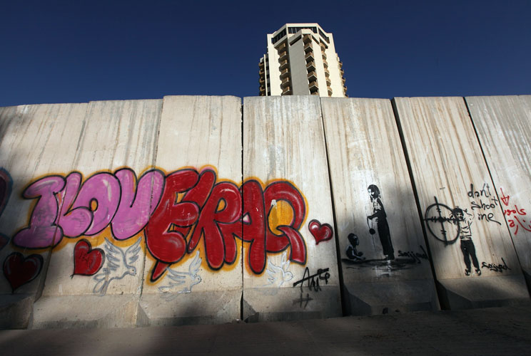 Graffiti is seen on a protective blast wall on December 3, 2011 in Baghdad, Iraq. Iraq is transitioning nearly nine years after the 2003 U.S. invasion and subsequent occupation. American forces are now in the midst of the final stage of withdrawal from th