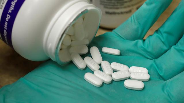 A pharmacist holds prescription painkiller OxyContin, 40mg pills, made by Purdue Pharma L.D. at a local pharmacy